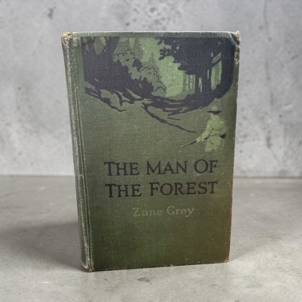 1920 Zane Grey The Man of the Forest first edition book in green pictorial cloth with forest scene cover art