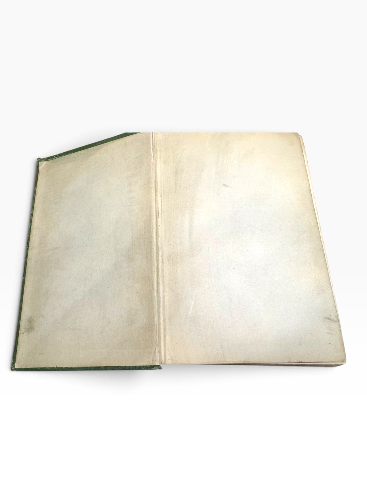 Open endpaper of a 1920 Zane Grey first edition book with age-toned paper and green cloth binding visible.